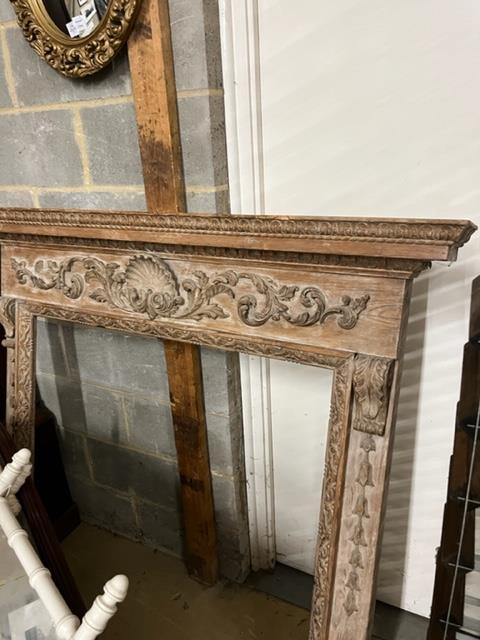A Georgian carved pine fire surround, width 143cm, height 135cm (aperture width 96cm, height 105cm)